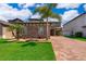 Charming single-Gathering home with brick accents, a manicured lawn, and a brick paver driveway at 3159 Somerset Park Dr, Orlando, FL 32824