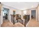 Second floor hallway with wood railing and decor at 3159 Somerset Park Dr, Orlando, FL 32824