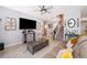 Cozy living room features tile floors, a ceiling fan, comfortable seating and decor at 3159 Somerset Park Dr, Orlando, FL 32824