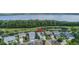 Scenic aerial view overlooking lakeside houses with solar panels in a beautiful community at 3349 Schoolhouse Rd, Harmony, FL 34773