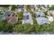 An aerial view of the home with a screened in pool and solar panels at 3349 Schoolhouse Rd, Harmony, FL 34773