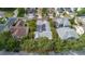An aerial view of the home with a screened in pool and solar panels at 3349 Schoolhouse Rd, Harmony, FL 34773