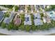 Aerial view of the home with a screened in pool and solar panels at 3349 Schoolhouse Rd, Harmony, FL 34773