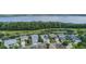 Scenic aerial view overlooking lakeside houses with solar panels in a beautiful community at 3349 Schoolhouse Rd, Harmony, FL 34773