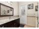 Bathroom with granite countertops, mosaic backsplash, and ample lighting, creating a spa-like atmosphere at 3349 Schoolhouse Rd, Harmony, FL 34773