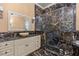 Lavish bathroom with marble accents, featuring a glass-enclosed shower and a modern vanity at 3349 Schoolhouse Rd, Harmony, FL 34773