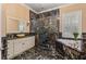 Luxurious bathroom with marble accents, featuring a glass enclosed shower and a soaking tub at 3349 Schoolhouse Rd, Harmony, FL 34773