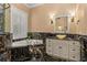 Elegant bathroom with marble accents, featuring a soaking tub and a stylish vanity at 3349 Schoolhouse Rd, Harmony, FL 34773