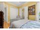 Bedroom boasting natural light, a large closet, and hardwood floors, offering comfort and functionality at 3349 Schoolhouse Rd, Harmony, FL 34773