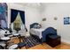 Quaint bedroom featuring a drum set, hardwood floors and fun decor at 3349 Schoolhouse Rd, Harmony, FL 34773