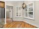 Dining area with hardwood floors, white shutters, and contemporary chandelier at 3349 Schoolhouse Rd, Harmony, FL 34773