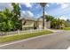 Beautiful house featuring lush landscaping, a pristine white picket fence, and a spacious two-car garage at 3349 Schoolhouse Rd, Harmony, FL 34773