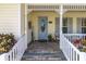 Inviting front porch with decorative trim and seating area at 3349 Schoolhouse Rd, Harmony, FL 34773