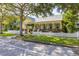 Charming yellow home with a white picket fence and lush landscaping at 3349 Schoolhouse Rd, Harmony, FL 34773