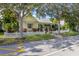 Charming yellow home with a white picket fence and lush landscaping at 3349 Schoolhouse Rd, Harmony, FL 34773