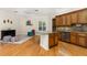 Open kitchen with island seating flows into a living area, creating a spacious, combined living experience at 3349 Schoolhouse Rd, Harmony, FL 34773