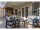 Enclosed patio area featuring an outdoor kitchen, comfortable seating, and perfect for entertaining at 3349 Schoolhouse Rd, Harmony, FL 34773