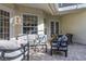 Enclosed patio area with comfortable seating, perfect for relaxation and enjoying the outdoors at 3349 Schoolhouse Rd, Harmony, FL 34773
