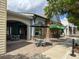 A cafe patio provides outdoor seating and a covered entryway for dining in the community at 3349 Schoolhouse Rd, Harmony, FL 34773