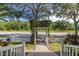View of trellised walkway leading to street at 3349 Schoolhouse Rd, Harmony, FL 34773