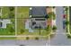 An aerial view showcases this home's backyard, solar panels, and the surrounding neighborhood at 3400 Mt Vernon Way, Kissimmee, FL 34741