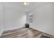 A minimalist bedroom with wood-look floors and a single window, offering a clean and simple space at 3400 Mt Vernon Way, Kissimmee, FL 34741