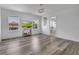 Spacious bedroom with wood floors, natural light, and view of neighborhood at 3400 Mt Vernon Way, Kissimmee, FL 34741
