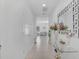 Bright entryway with white walls, tile floors, decorative mirror, and console table at 3400 Mt Vernon Way, Kissimmee, FL 34741