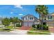 A beautiful two-story home with a red brick driveway, a two-car garage, and manicured landscaping at 3400 Mt Vernon Way, Kissimmee, FL 34741