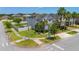 Charming two-story home with a well-manicured lawn, palm trees, and fenced backyard at 3400 Mt Vernon Way, Kissimmee, FL 34741