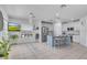 Bright, open kitchen with stainless steel appliances, an island with seating, and ample natural light at 3400 Mt Vernon Way, Kissimmee, FL 34741