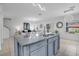 Bright kitchen features a large island, stainless steel sink, and open floor plan at 3400 Mt Vernon Way, Kissimmee, FL 34741