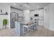 Modern kitchen boasts granite counters, stainless appliances, and a large center island at 3400 Mt Vernon Way, Kissimmee, FL 34741