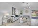 Stylish living room with modern decor, tile flooring, plush seating, and access to the backyard at 3400 Mt Vernon Way, Kissimmee, FL 34741