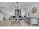 Bright and airy living room with tile floors, stylish seating, and unique decor, ideal for gatherings at 3400 Mt Vernon Way, Kissimmee, FL 34741