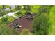 An aerial view of a well-maintained playground with mature trees and a safety fence at 3400 Mt Vernon Way, Kissimmee, FL 34741