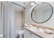 Bathroom featuring a shower and bathtub combo, a sink vanity with a large mirror and a toilet at 344 High Point Dr, Davenport, FL 33837