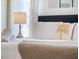 Relaxing bedroom detail showcasing plush pillows and a soft throw blanket at 344 High Point Dr, Davenport, FL 33837