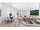 Eat-in kitchen with a dining table set for a meal, and a view of the patio through sliding glass doors at 344 High Point Dr, Davenport, FL 33837