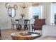 Dining space with a table set for six, sheer curtains, and an open floor plan concept at 344 High Point Dr, Davenport, FL 33837