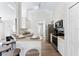 Modern kitchen with stainless steel appliances, bar stool seating, and an open concept design at 344 High Point Dr, Davenport, FL 33837