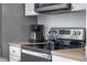 Close-up on updated kitchen appliances and countertops featuring a coffee maker and electric kettle at 344 High Point Dr, Davenport, FL 33837