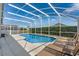 Beautiful screened pool and lanai area for relaxing or entertaining at 344 High Point Dr, Davenport, FL 33837
