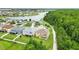 Aerial view of homes in community, showing lake, walking path and trees at 3899 Mount Vernon Way, Kissimmee, FL 34741