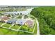 Aerial view of home and backyard, showing lake, walking path and trees at 3899 Mount Vernon Way, Kissimmee, FL 34741