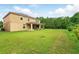 Wide backyard and house with covered patio, nice view of nature at 3899 Mount Vernon Way, Kissimmee, FL 34741