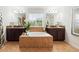 Bathroom boasts a soaking tub with tiled surround, double vanity sinks, and a large window at 3899 Mount Vernon Way, Kissimmee, FL 34741