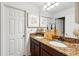 Bathroom features double sinks, granite counters, and modern fixtures at 3899 Mount Vernon Way, Kissimmee, FL 34741