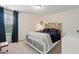 Modern bedroom featuring a bed, and neutral carpeting, illuminated by natural light at 3899 Mount Vernon Way, Kissimmee, FL 34741