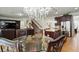 The dining area showcases seamless access to the kitchen, living room, and staircase at 3899 Mount Vernon Way, Kissimmee, FL 34741